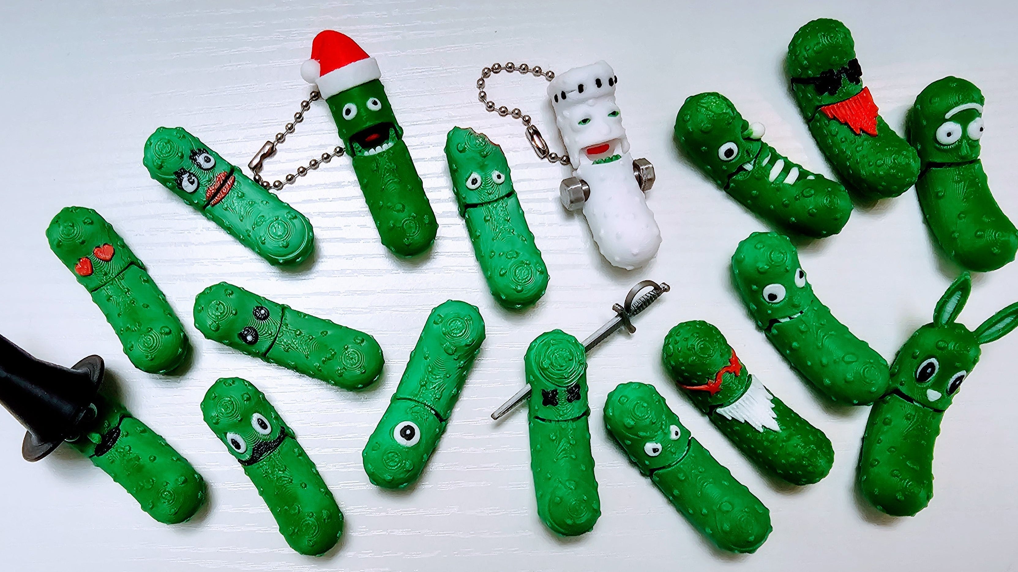 Collection of green 3d printed pickles on a white background